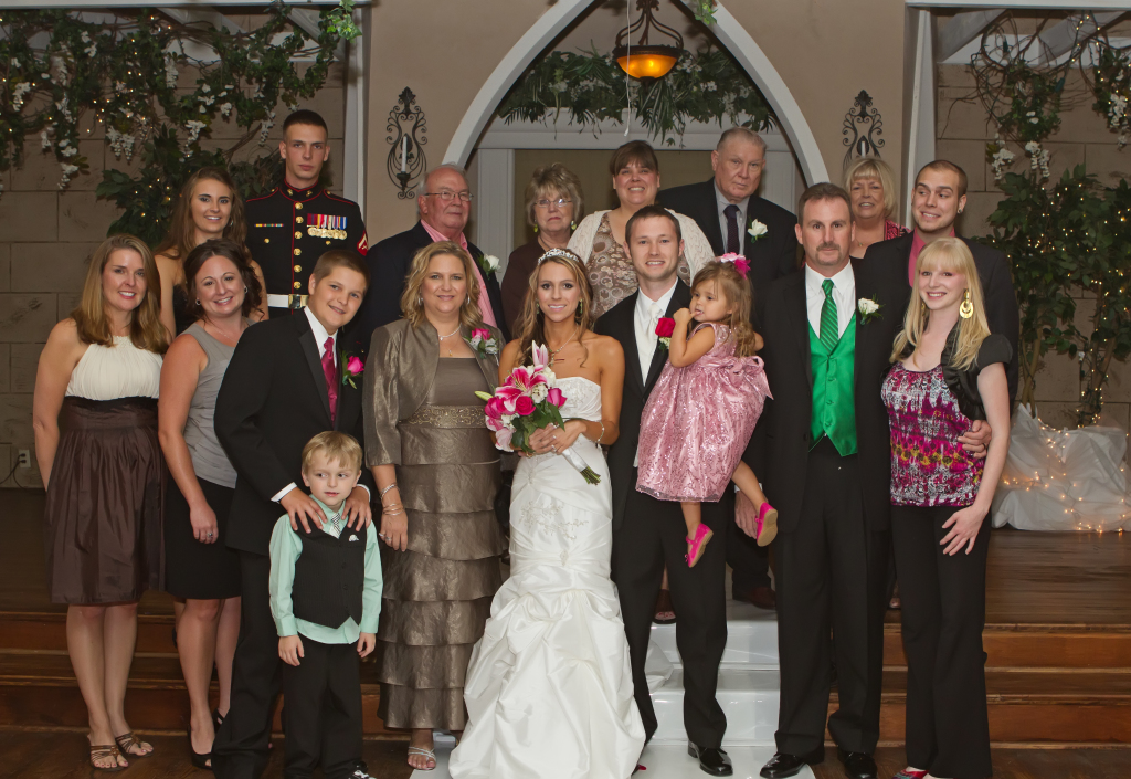 Lisa at her daughter's wedding with her husband, children, grandchildren, parents, sisters, nieces, nephews and in-laws.